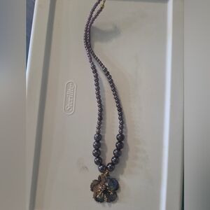 Elegant Purple Beaded Necklace with Floral Pendant